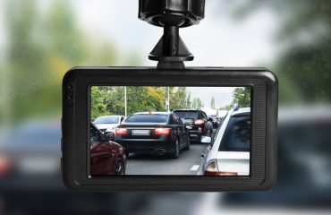 Dashcam attached to car windshield