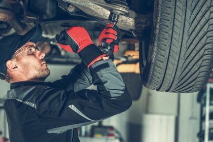 Mechanic working on suspension