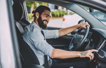 Man using car stereo