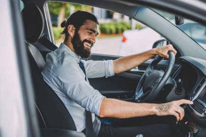 Man using car stereo