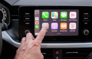 person using apple carplay display