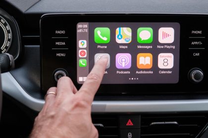 person using apple carplay display