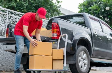 delivery man loading pickup truck