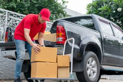 delivery man loading pickup truck