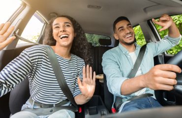 Driver and passenger listening to music