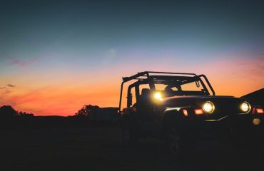 Jeep Wrangler with accessories at sunset