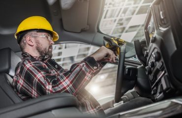 A Construction Worker Sitting Inside Truck