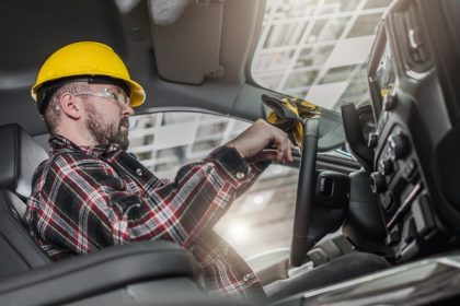 A Construction Worker Sitting Inside Truck