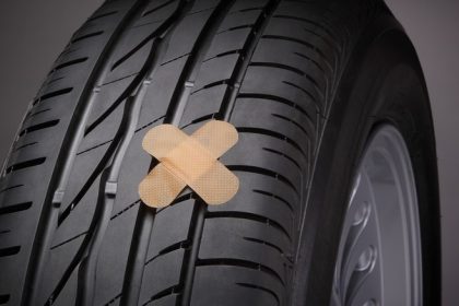 Tire with cross-shaped patch